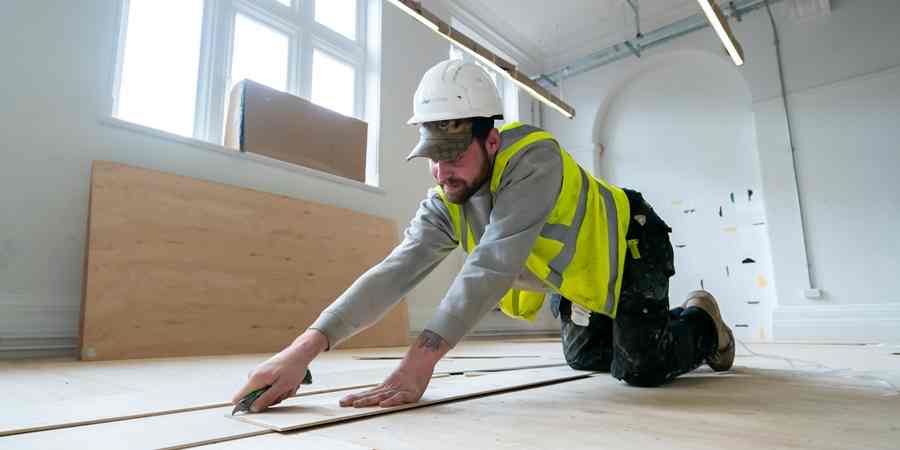 A contractor working on the floor.