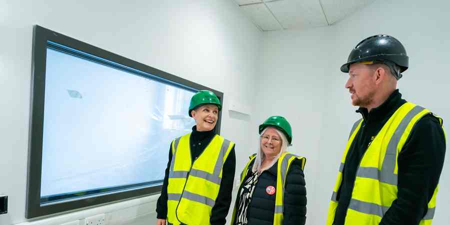 Estelle Rowe, Councillor Sue Smith and Mark Taylor on a guided tour of the venue.