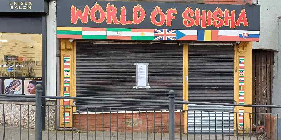 Shuttered World of Shisha shop.