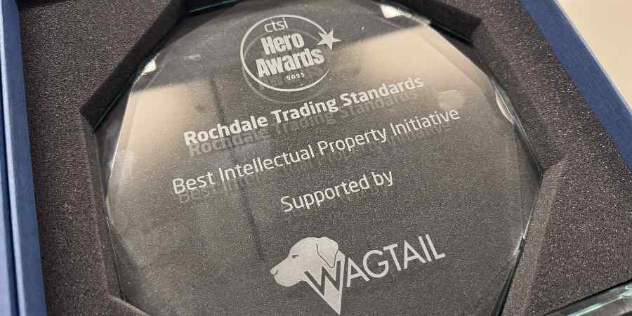 The glass trophy won by the trading standards team.