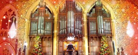 An organist stood in front of the organ at Rochdale Town Hall.
