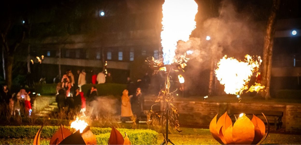 Flaming sculptures at night