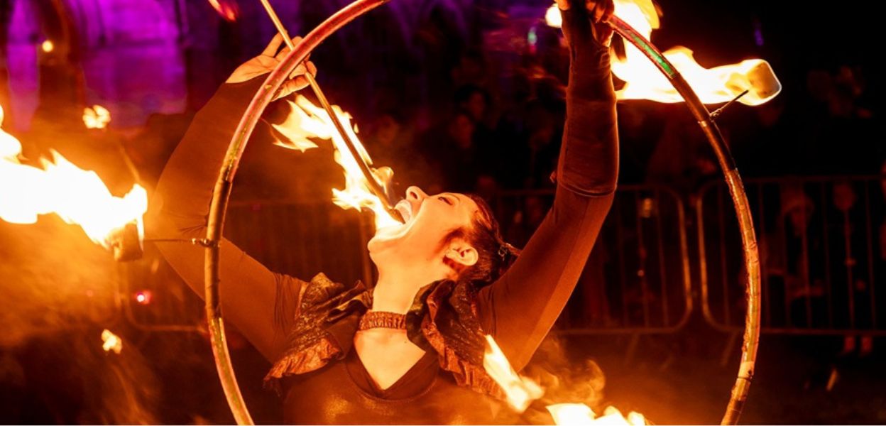 A perfomer &#039;swallowing&#039; fire.