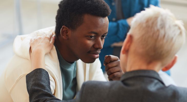 A young person speaking to their carer.