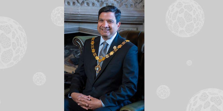 Councillor Faisal Rana wearing mayoral chain.