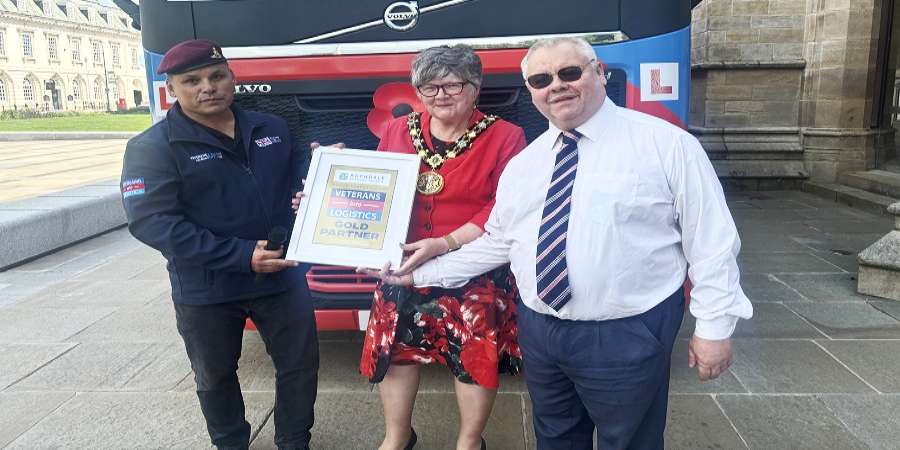 Darren Wright presenting certificate to Councillors Janet Emsley and Neil Emmott.