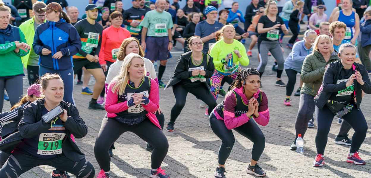 Half Marathon runners warming up.