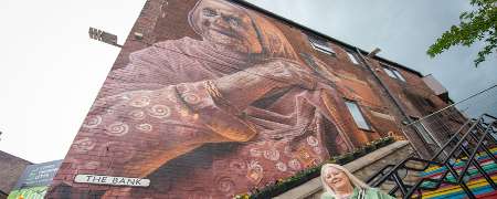 Councillor Sue Smith under one of the new murals.