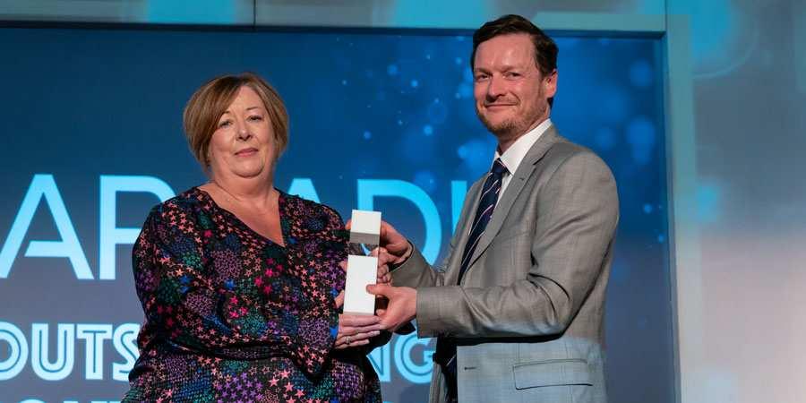 Aileen Bollard presented with her award by Julian Cobley.