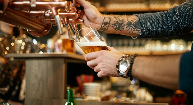 A pint of beer being pulled.