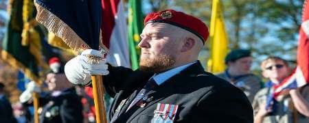 Veteran holding a flag.