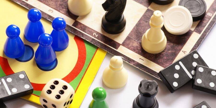 A variety of dominos and board game tokens.