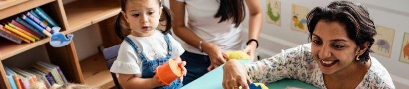 Children playing with a carer