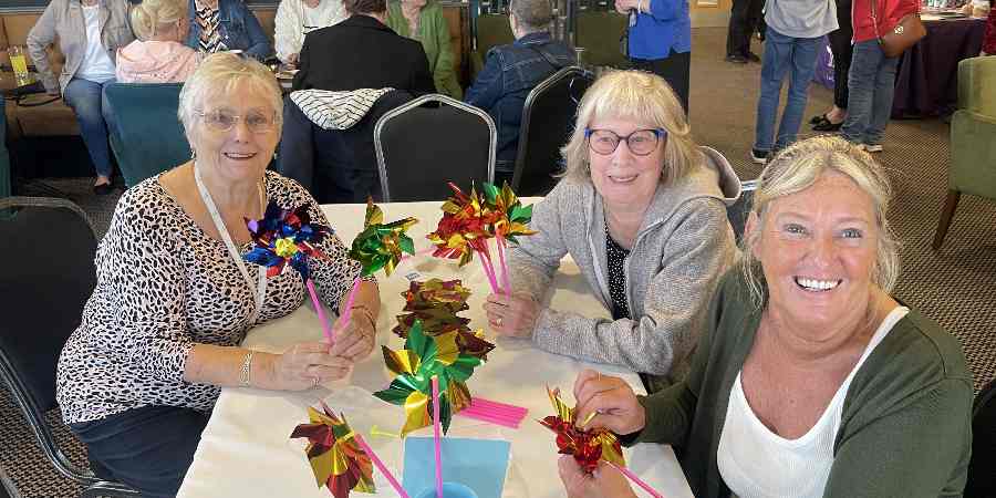 Carers sat at a table.