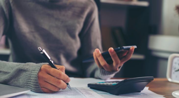 A person doing their taxes on their phone.