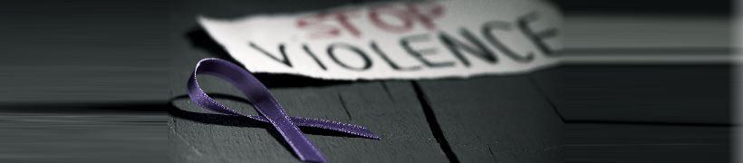 A purple ribbon next to a note reading, Stop violence.