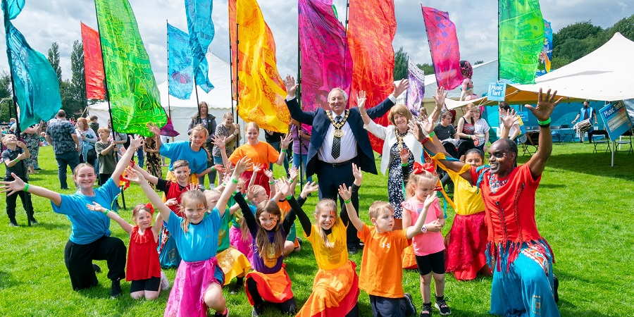 Mayor councillor Mike Holly (second from right, back row) and mayoress Margaret Holly (right, back row) enjoying the fun at the Feel Good Family Picnic in Middleton with members of Global Grooves.