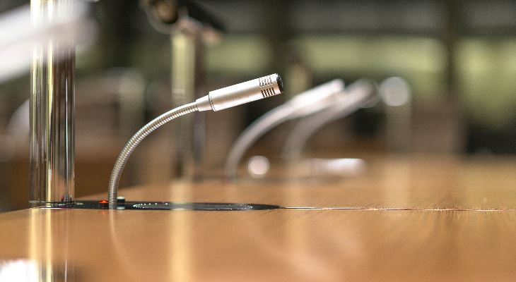 Microphones at a council table.