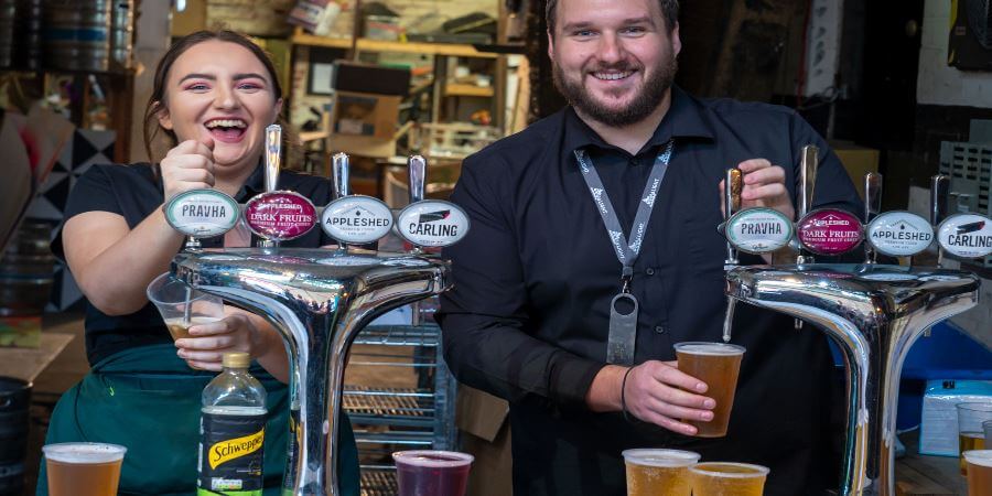 The bar staff at the Flying Horse Hotel.