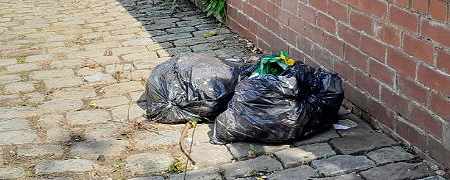 2 bags of fly-tipped waste.