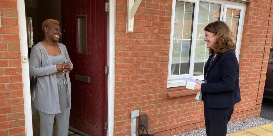 Assistant director of children’s social care, Julia Hassall, surprises one of our foster carers with a cake delivery. 