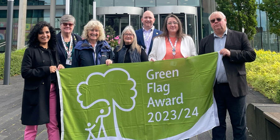 Councillor Amber Nisa; Councillor Janet Emsley; Councillor Tricia Ayrton; Councillor June West; Councillor Phil Massey; and Councillor Neil Emmott, leader of the council, celebrating the borough’s 11 Green Flag Awards.