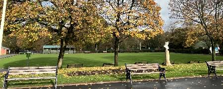 Queens Park bowling green in autumn.