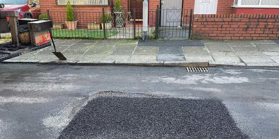 A filled-in pothole.