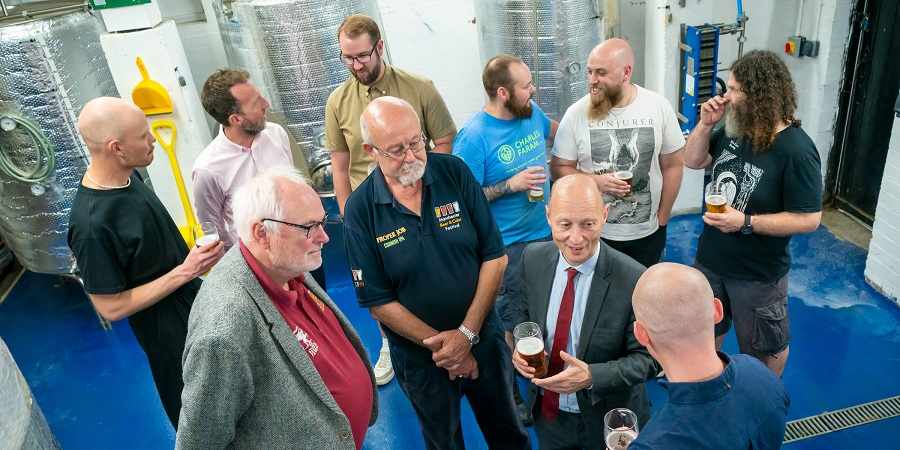 Paul Waugh MP with Rochdale BID manager Paul Ambrose and brewers.