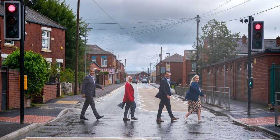 Councillors Shah Wazir, Sameena Zaheer, Iftikhar Ahmed and former head Sandra Hartley using the new crossing.