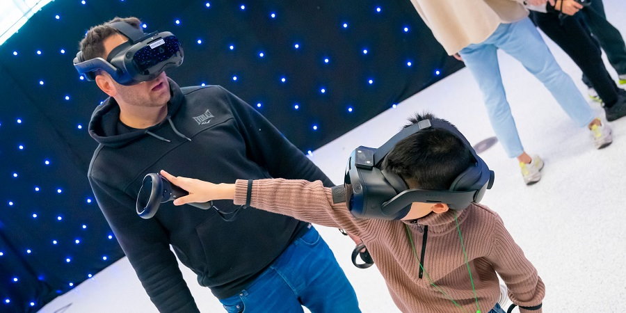 Visitors to the Theatre Electric exhibition wearing virtual reality headsets.