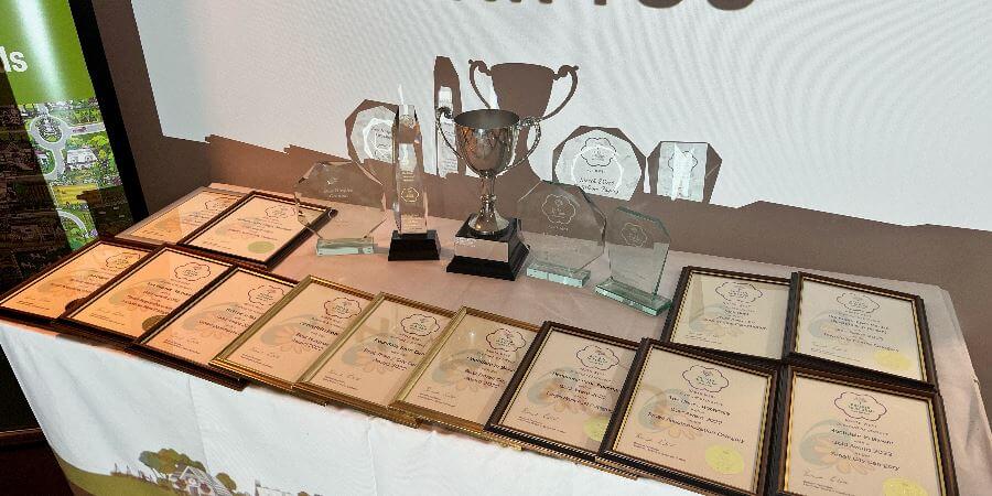 In Bloom award certificates.