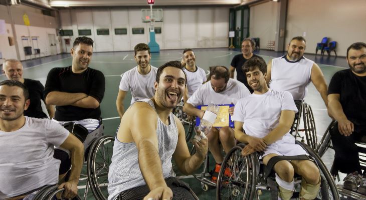 Wheelchair basketball players taking a selfie.