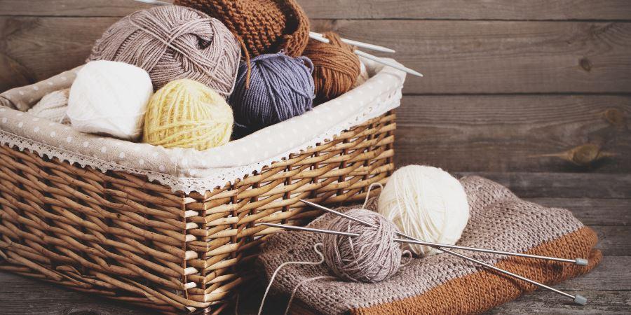 A basket full of balls of wool.