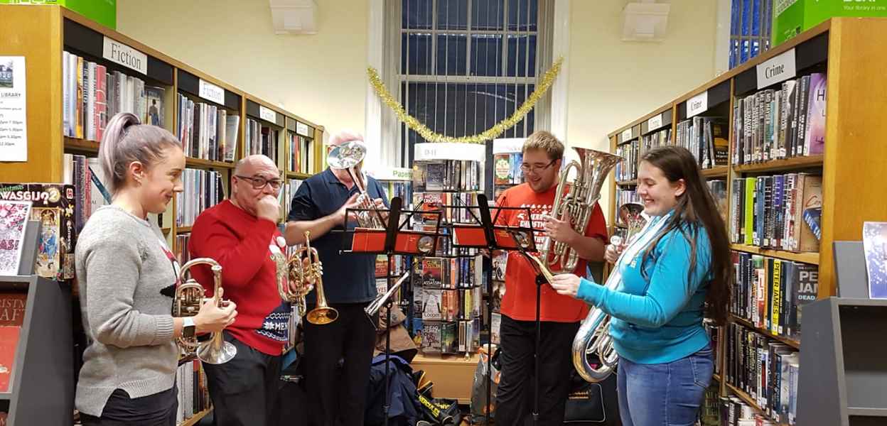A festive brass band performance in Littleborough Library.