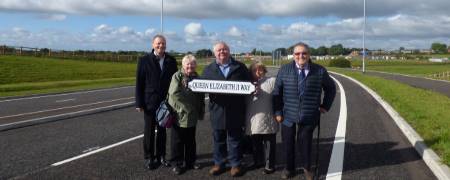 Councillors stood on Queen Elizabeth 2 Way.