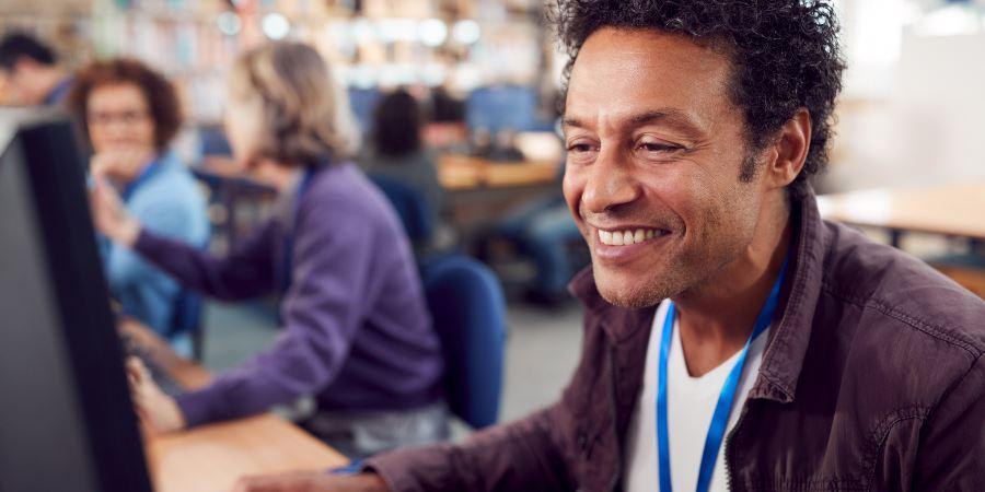 Adults enjoying a computer class.