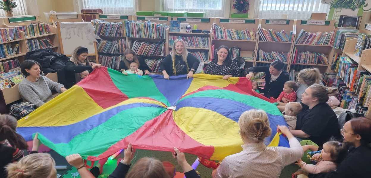 A Bookstart Baby session in action with parachute at Littleborough Library.