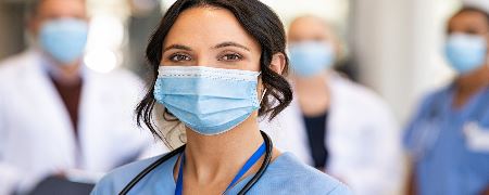 Nurse wearing a face mask.