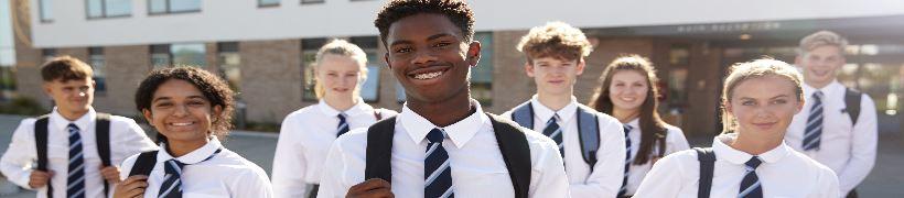 A row of smiling schoolchildren.