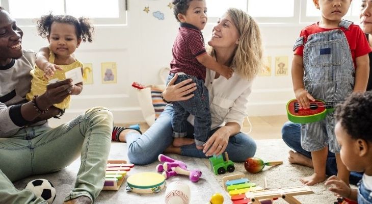 Parents and children playing with toys.