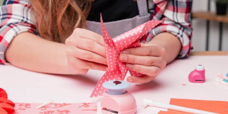 A child working on a pinwheel.