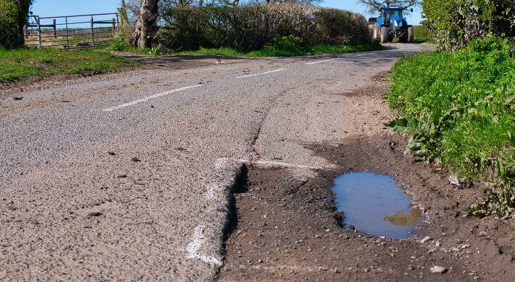 A pothole in a country road.