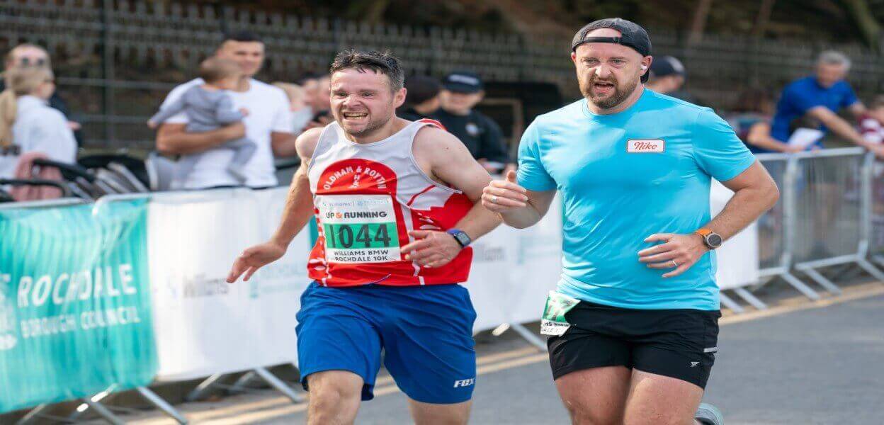 2 runners nearing the end of the marathon.