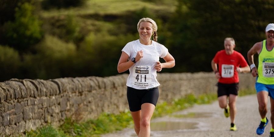 Runner in the Half Marathon, passing Hollingworth Lake.