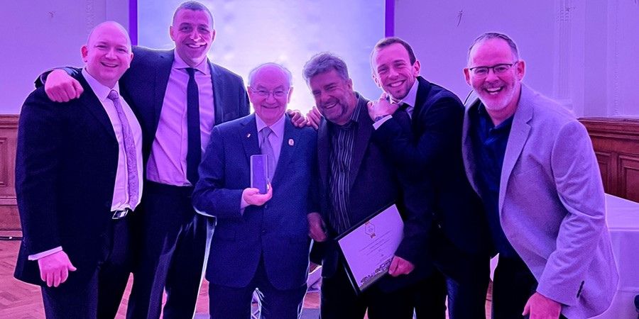 Councillors and council staff receiving the In Bloom award.