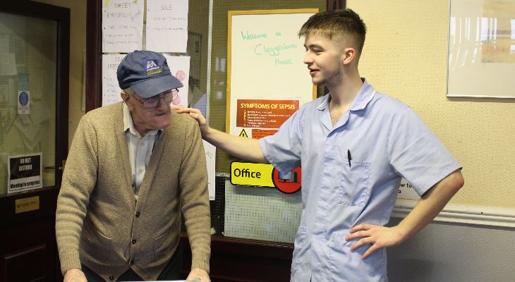 A carer with an elderly care service user.