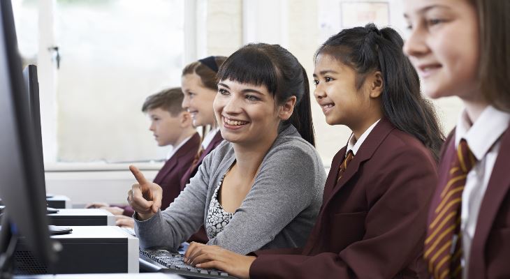 Secondary school pupils in a computer class.