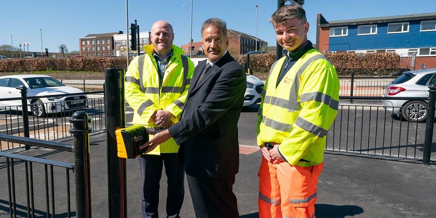 Councillor Shah Wazir with contractors at the crossing.