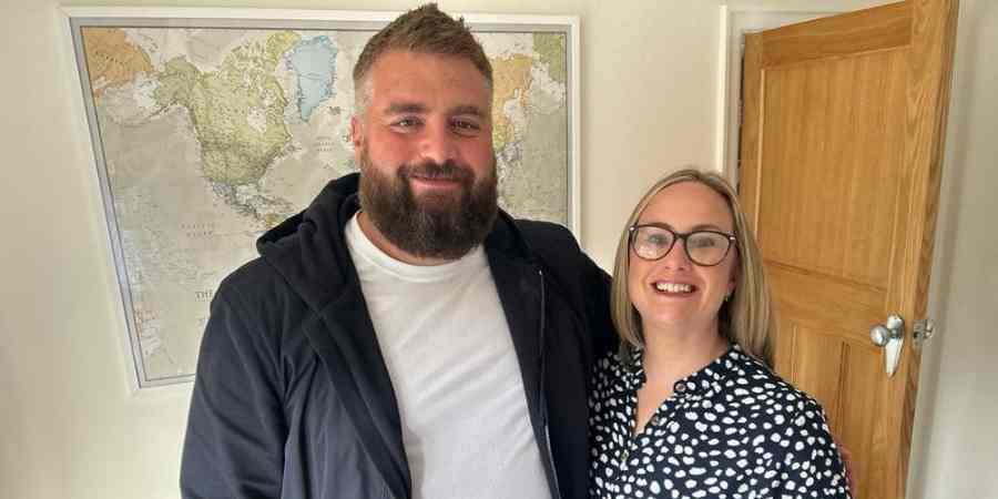 James and Katie in their living room.